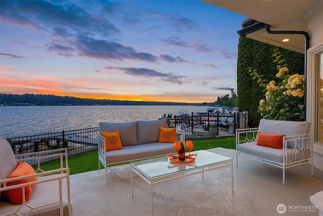 2819 E Lake Sammamish Pkwy NE, Sammamish, WA 98074 - patio terrace at dusk featuring a water view, a patio, and an outdoor hangout area