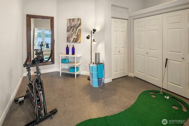 2819 E Lake Sammamish Pkwy NE, Sammamish, WA 98074 - workout room with baseboards and dark tile patterned flooring