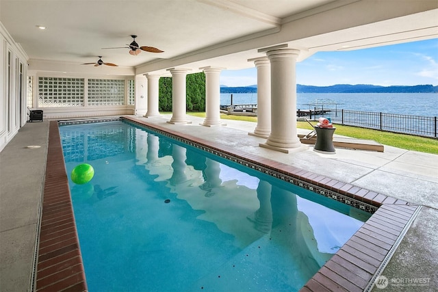 2819 E Lake Sammamish Pkwy NE, Sammamish, WA 98074 - view of swimming pool featuring a water and mountain view, a ceiling fan, and a patio
