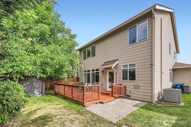4015 134th Pl SE, Mill Creek, WA 98012 - back of house featuring a wooden deck and a storage unit