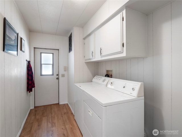 11436 SE 208th St Unit 45, Kent, WA 98031 - laundry room featuring cabinet space, washing machine and dryer, and light wood-style flooring
