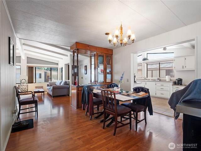 11436 SE 208th St Unit 45, Kent, WA 98031 - dining space with a chandelier, healthy amount of natural light, light wood-style floors, and vaulted ceiling