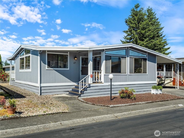 11436 SE 208th St Unit 45, Kent, WA 98031 - manufactured / mobile home featuring a porch