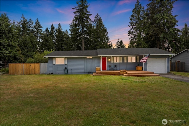 21318 125th St E, Bonney Lake, WA 98391 - single story home with an attached garage, crawl space, asphalt driveway, and a wooden deck