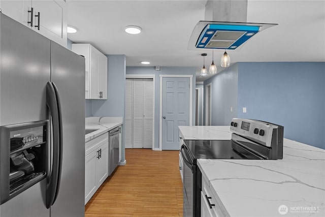 21318 125th St E, Bonney Lake, WA 98391 - kitchen with appliances with stainless steel finishes, light wood-style flooring, white cabinetry, and light stone countertops