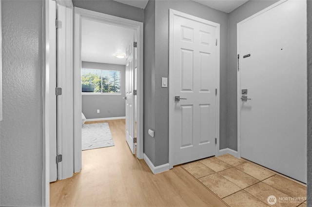 12906 8th Ave W Unit C102, Everett, WA 98204 - entrance foyer with light wood-type flooring and baseboards