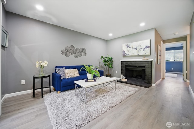 12906 8th Ave W Unit C102, Everett, WA 98204 - living area featuring light wood-style floors, a fireplace, and recessed lighting