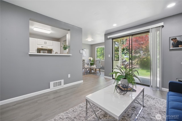 12906 8th Ave W Unit C102, Everett, WA 98204 - living room with light wood-style floors and recessed lighting