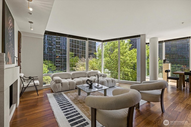 10700 NE 4th St Unit 712, Bellevue, WA 98004 - living room featuring a wall of windows and wood finished floors