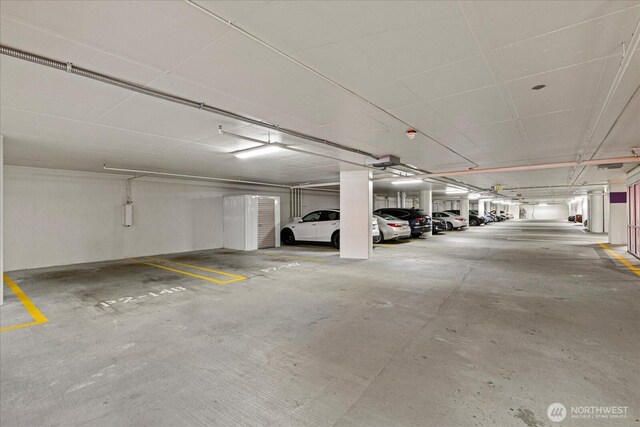 10700 NE 4th St Unit 712, Bellevue, WA 98004 - parking garage featuring a garage door opener