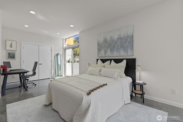 1100 14th Ave, Seattle, WA 98122 - bedroom with finished concrete floors, recessed lighting, a closet, and an office area