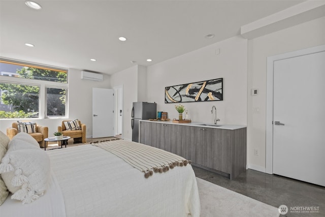 1100 14th Ave, Seattle, WA 98122 - bedroom with freestanding refrigerator, a wall mounted AC, recessed lighting, finished concrete flooring, and bar with sink