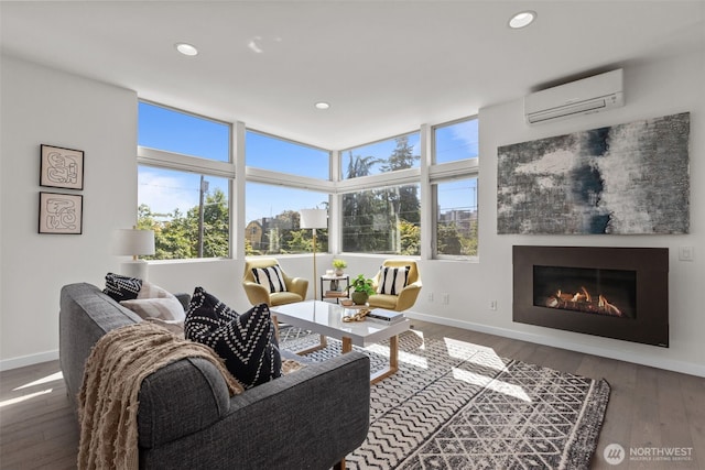 1100 14th Ave, Seattle, WA 98122 - living room with a wall mounted AC, hardwood / wood-style flooring, recessed lighting, and a glass covered fireplace
