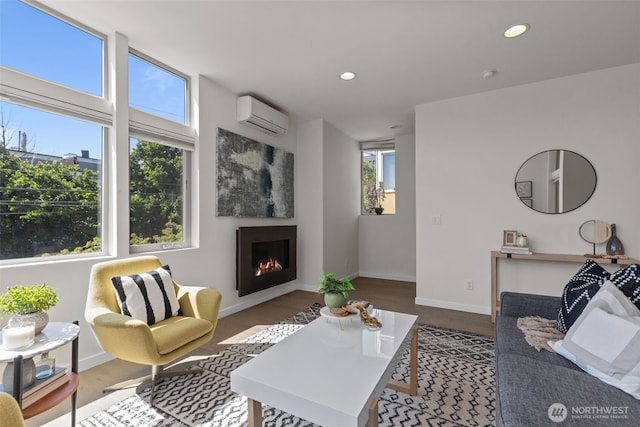 1100 14th Ave, Seattle, WA 98122 - living room featuring a wall mounted air conditioner, a warm lit fireplace, wood finished floors, and recessed lighting