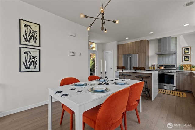 1100 14th Ave, Seattle, WA 98122 - dining area with hardwood / wood-style flooring, a chandelier, and recessed lighting