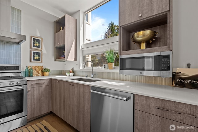 1100 14th Ave, Seattle, WA 98122 - kitchen with appliances with stainless steel finishes, wall chimney exhaust hood, open shelves, light countertops, and dark wood-style flooring