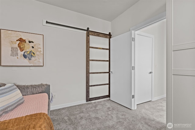 1100 14th Ave, Seattle, WA 98122 - carpeted bedroom with a barn door and baseboards