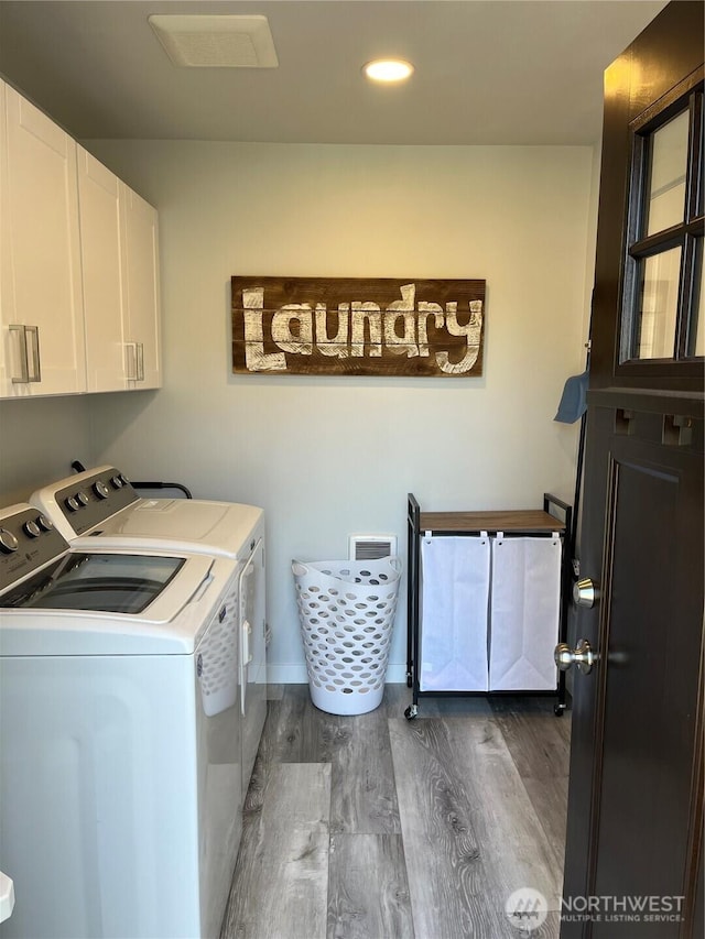 916 35th St, Anacortes, WA 98221 - laundry area with cabinet space, washer and dryer, dark wood-style floors, and recessed lighting