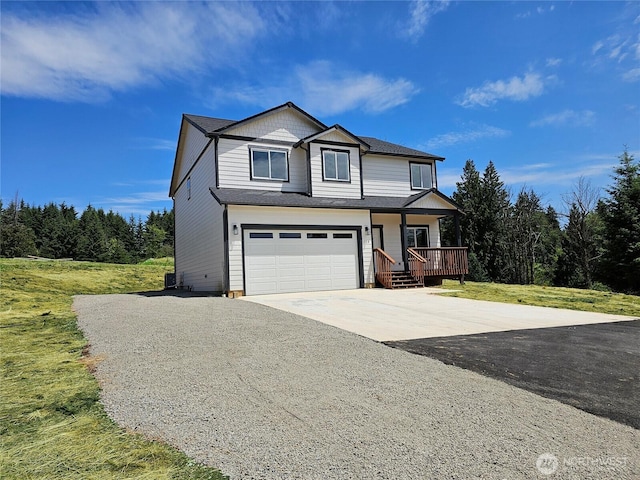 119 Davis View Dr, Centralia, WA 98531 - view of front facade featuring driveway, covered porch, an attached garage, and a front yard