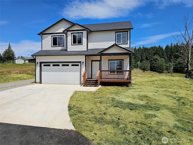 119 Davis View Dr, Centralia, WA 98531 - view of front of home with a garage, a front yard, concrete driveway, and covered porch