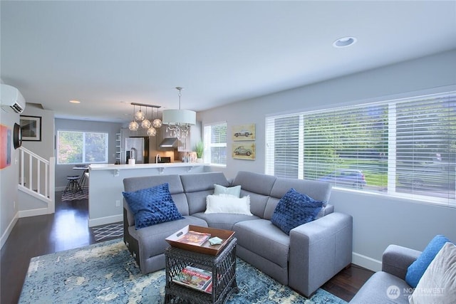 2067 Gilman Dr W, Seattle, WA 98119 - living room with a wall mounted AC, recessed lighting, and dark wood-type flooring
