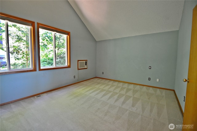 1923 SE Maple Dr, Chehalis, WA 98532 - bonus room with lofted ceiling, healthy amount of natural light, light colored carpet, a textured ceiling, and a wall mounted AC