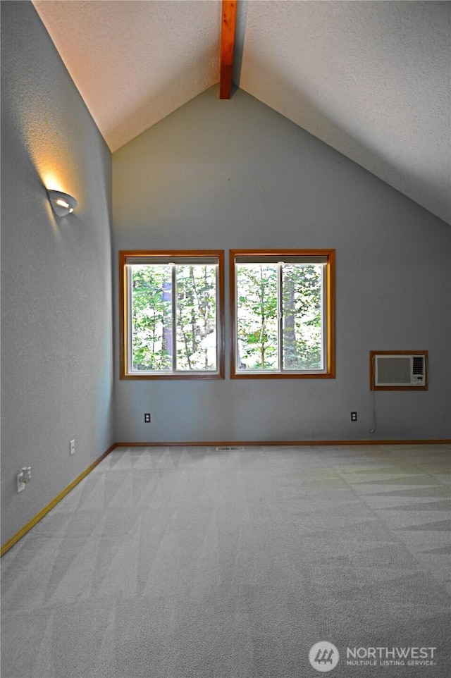 1923 SE Maple Dr, Chehalis, WA 98532 - unfurnished room with a wall mounted AC, light carpet, and a textured ceiling
