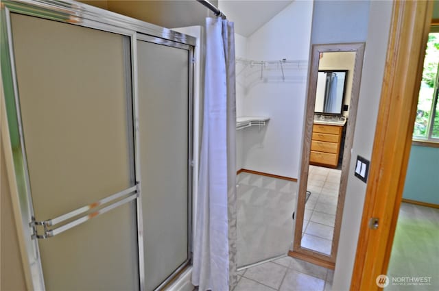 1923 SE Maple Dr, Chehalis, WA 98532 - full bathroom with a shower stall, tile patterned floors, vanity, a spacious closet, and lofted ceiling