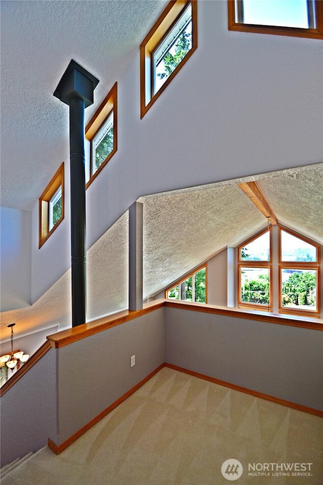 1923 SE Maple Dr, Chehalis, WA 98532 - interior space with a textured ceiling, carpet floors, and lofted ceiling
