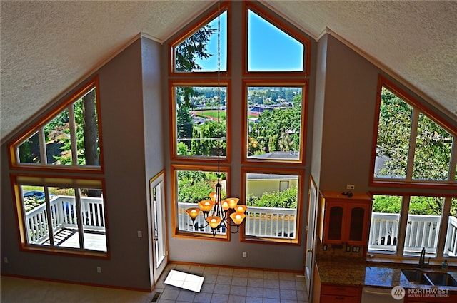 1923 SE Maple Dr, Chehalis, WA 98532 - detailed view of a textured ceiling, a chandelier, crown molding, and dishwasher