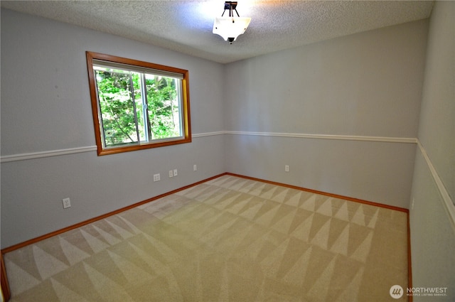 1923 SE Maple Dr, Chehalis, WA 98532 - carpeted empty room with a textured ceiling and baseboards