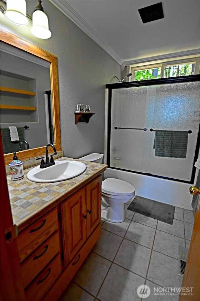 1923 SE Maple Dr, Chehalis, WA 98532 - full bath featuring vanity, combined bath / shower with glass door, crown molding, and tile patterned floors