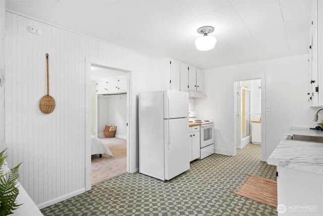 3032 Tulip Rd, Bellingham, WA 98225 - kitchen with white appliances, light countertops, light flooring, under cabinet range hood, and white cabinets