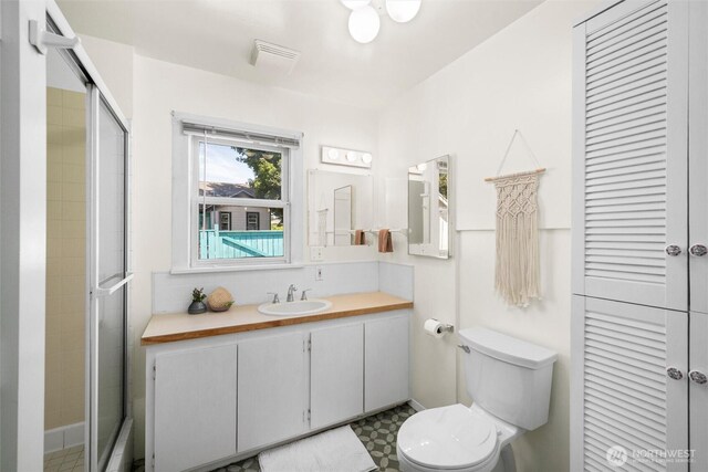 3032 Tulip Rd, Bellingham, WA 98225 - full bathroom with vanity, a shower with shower door, and tile patterned floors