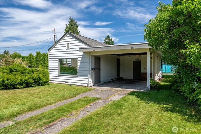 3032 Tulip Rd, Bellingham, WA 98225 - view of front of home featuring driveway, an attached carport, and a front lawn