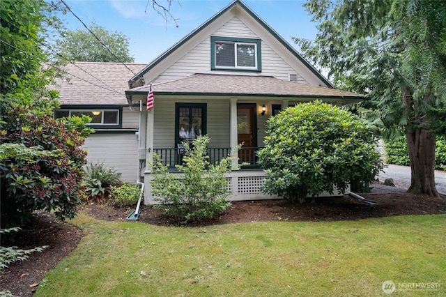 8213 S Fawcett Ave, Tacoma, WA 98408 - view of front facade featuring a porch, a front yard, and roof with shingles