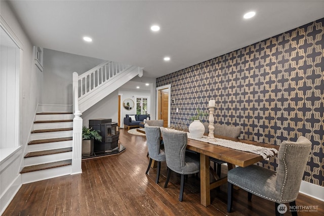 8213 S Fawcett Ave, Tacoma, WA 98408 - dining room with stairway, a wood stove, hardwood / wood-style flooring, wallpapered walls, and recessed lighting