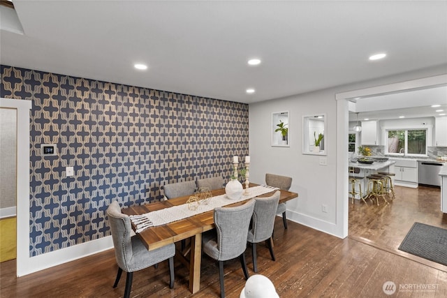 8213 S Fawcett Ave, Tacoma, WA 98408 - dining area featuring wallpapered walls, an accent wall, recessed lighting, and dark wood finished floors