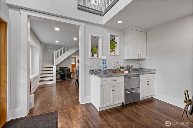 8213 S Fawcett Ave, Tacoma, WA 98408 - kitchen featuring light stone counters, dark wood-type flooring, stainless steel dishwasher, white cabinets, and recessed lighting