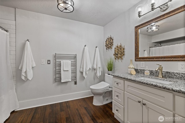 8213 S Fawcett Ave, Tacoma, WA 98408 - full bath with vanity, wood finished floors, a textured ceiling, and a shower with shower curtain