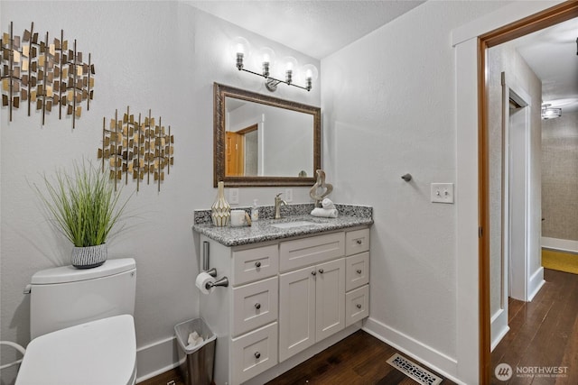 8213 S Fawcett Ave, Tacoma, WA 98408 - half bathroom featuring vanity and wood finished floors