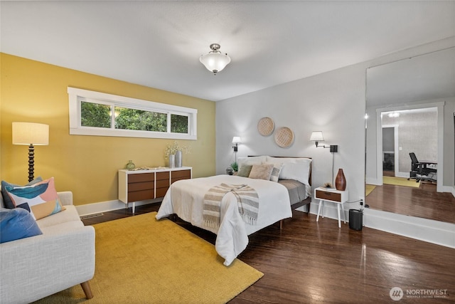 8213 S Fawcett Ave, Tacoma, WA 98408 - bedroom with baseboards and wood finished floors