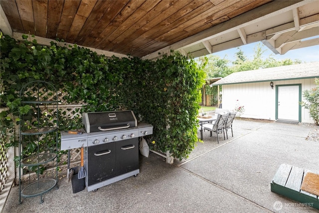 8213 S Fawcett Ave, Tacoma, WA 98408 - view of patio with a grill and outdoor dining space