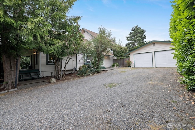 8213 S Fawcett Ave, Tacoma, WA 98408 - obstructed view of property with a garage and an outdoor structure