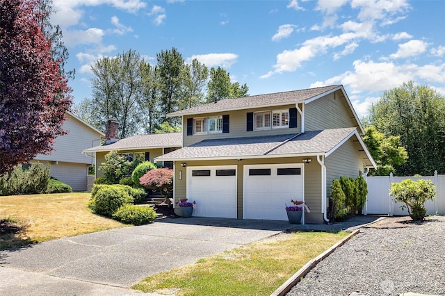13605 SE 233rd St, Kent, WA 98042 - view of front of house featuring driveway, roof with shingles, and an attached garage