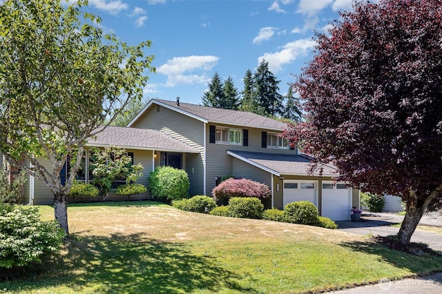 13605 SE 233rd St, Kent, WA 98042 - view of front of house with an attached garage, driveway, a front lawn, and a shingled roof