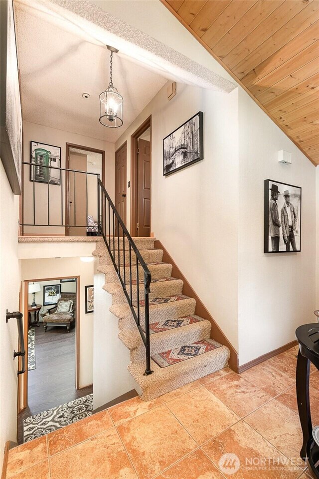 13605 SE 233rd St, Kent, WA 98042 - stairs featuring lofted ceiling and wooden ceiling