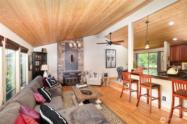13605 SE 233rd St, Kent, WA 98042 - living room featuring vaulted ceiling, wooden ceiling, light wood finished floors, a chandelier, and ceiling fan