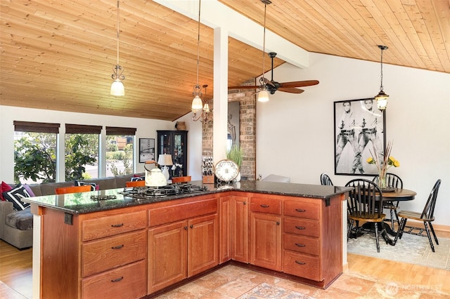 13605 SE 233rd St, Kent, WA 98042 - kitchen featuring wood ceiling, black gas stovetop, decorative light fixtures, dark stone counters, and brown cabinetry