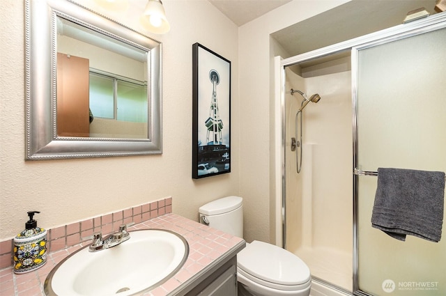 13605 SE 233rd St, Kent, WA 98042 - bathroom with a shower stall, vanity, and tasteful backsplash